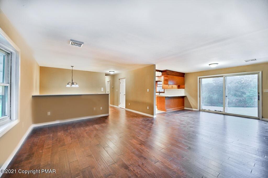171 VanWhy Road Bushkill, PA 18324 - Photo 15 of 61 a view of an empty room with a window and wooden floor