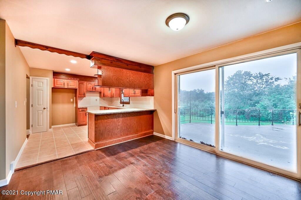 171 VanWhy Road Bushkill, PA 18324 - Photo 17 of 61 a view of kitchen with refrigerator and wooden floor