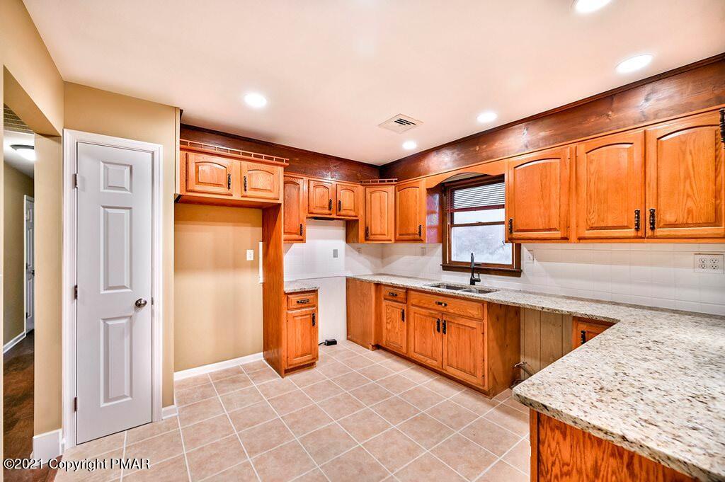 171 VanWhy Road Bushkill, PA 18324 - Photo 18 of 61 a large kitchen with stainless steel appliances granite countertop a refrigerator and a sink