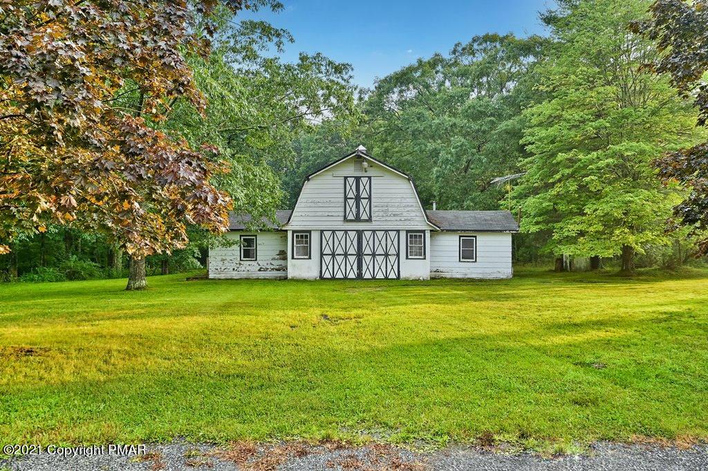171 VanWhy Road Bushkill, PA 18324 - Photo 2 of 61 a front view of a house with a garden