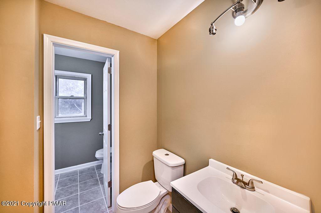 171 VanWhy Road Bushkill, PA 18324 - Photo 30 of 61 a bathroom with a toilet a sink and shower