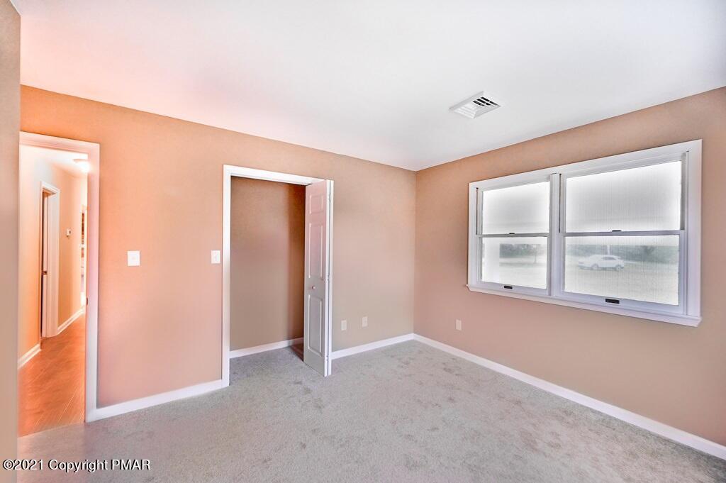 171 VanWhy Road Bushkill, PA 18324 - Photo 33 of 61 an empty room with a window