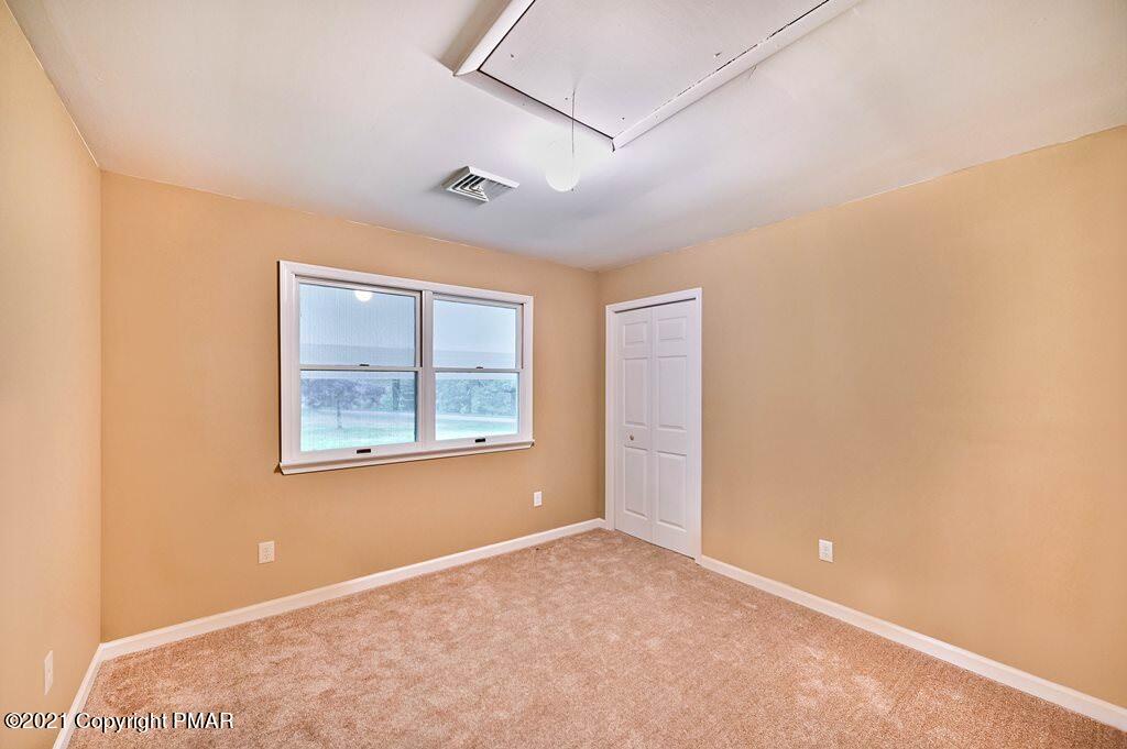 171 VanWhy Road Bushkill, PA 18324 - Photo 34 of 61 an empty room with windows