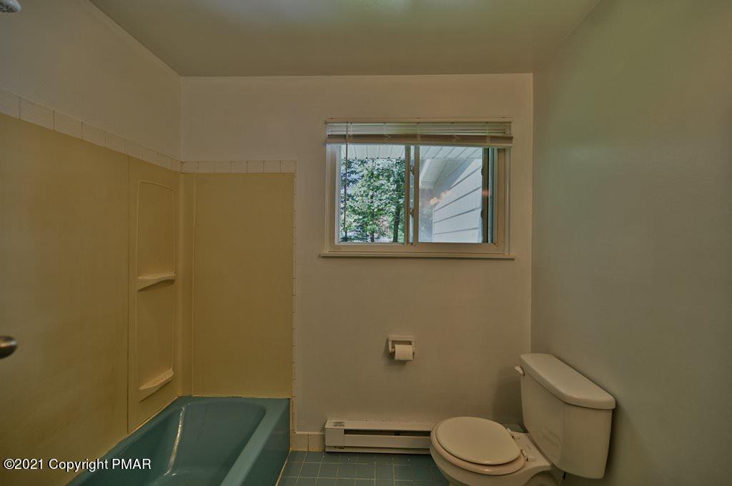 171 VanWhy Road Bushkill, PA 18324 - Photo 40 of 61 a bathroom with a toilet and a sink