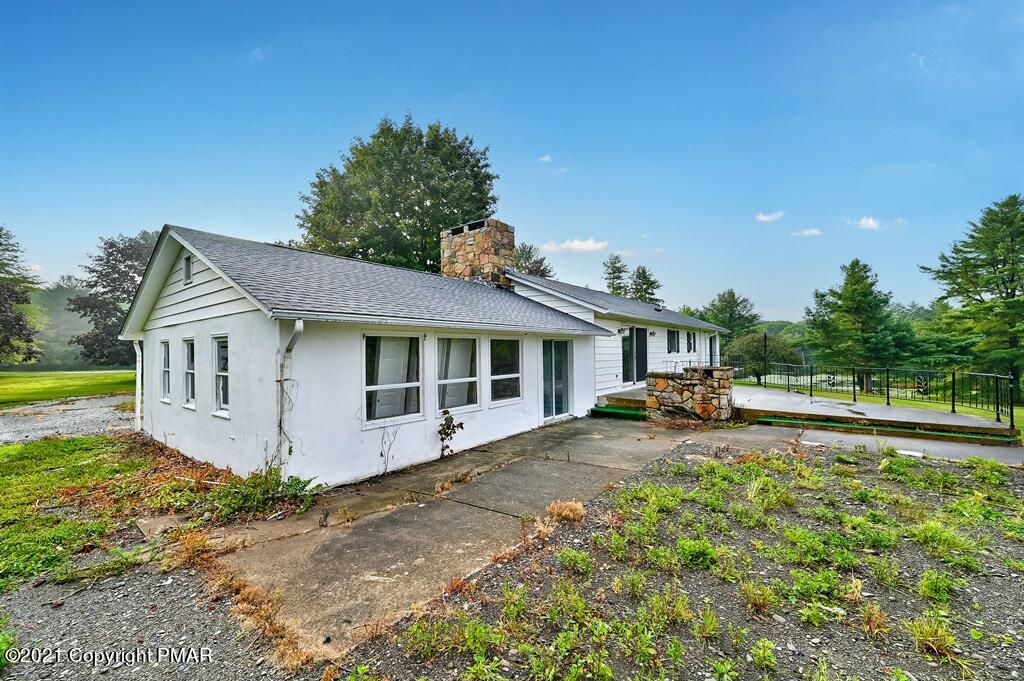 171 VanWhy Road Bushkill, PA 18324 - Photo 53 of 61 a view of a house with a yard and sitting area