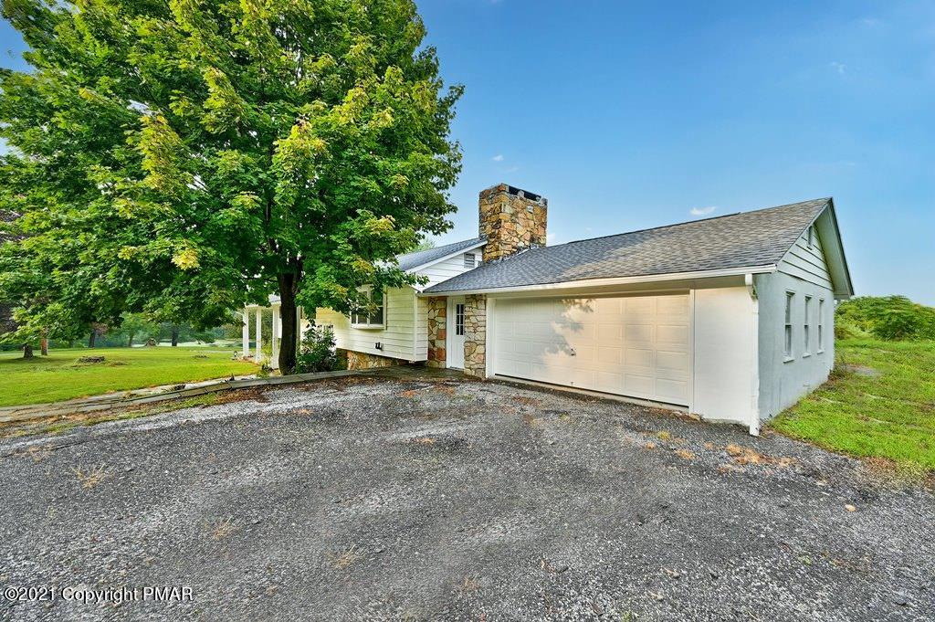 171 VanWhy Road Bushkill, PA 18324 - Photo 54 of 61 a view of a house with a yard and garage