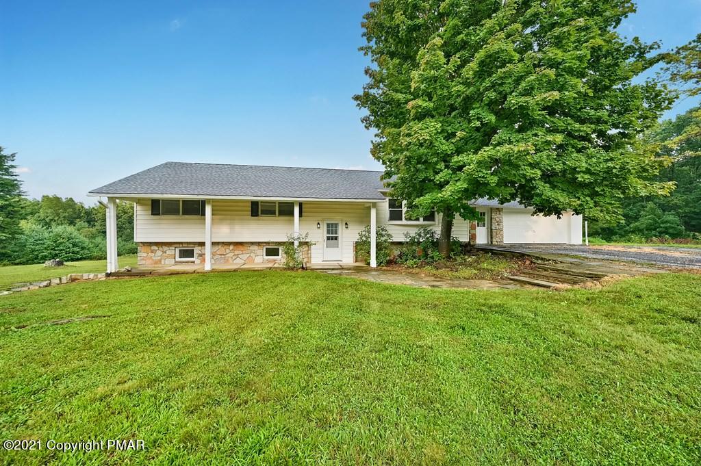 171 VanWhy Road Bushkill, PA 18324 - Photo 56 of 61 a front view of a house with a yard