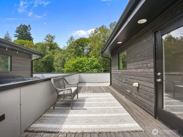 a balcony with view of outdoor space