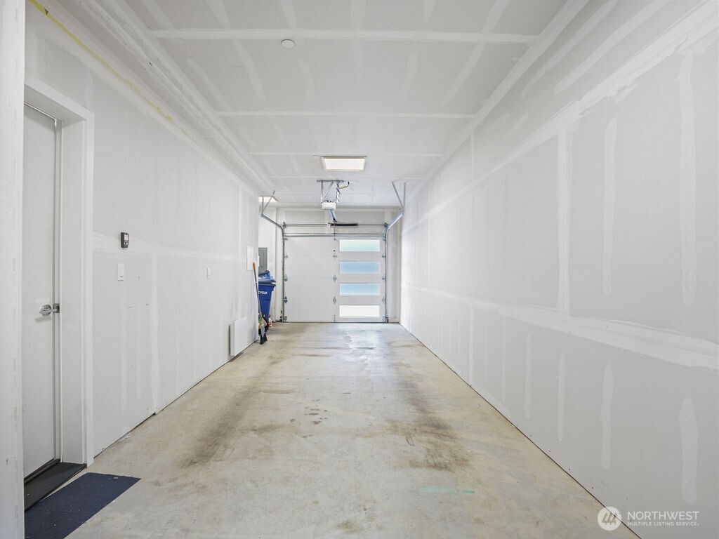 17338 Bothell Way Northeast, Unit E Bothell, WA 98011 - Photo 22 of 26 a view of a room with an empty space