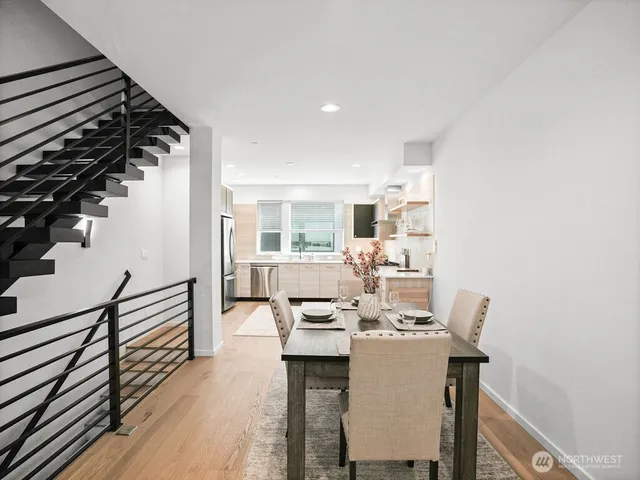 a view of a dining room with furniture and wooden floor
