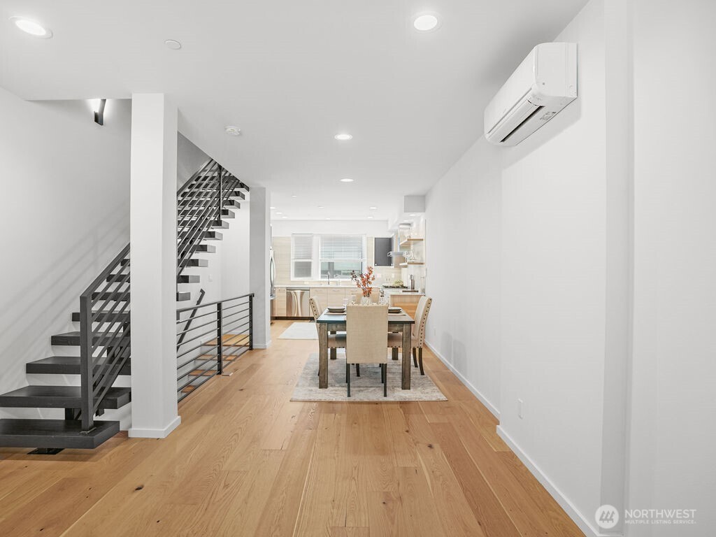 17338 Bothell Way Northeast, Unit E Bothell, WA 98011 - Photo 7 of 26 a view of a room with furniture and wooden floor