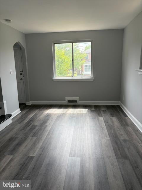 3024 M Street Southeast Washington, DC 20019 - Photo 2 of 8 an empty room with wooden floor and windows