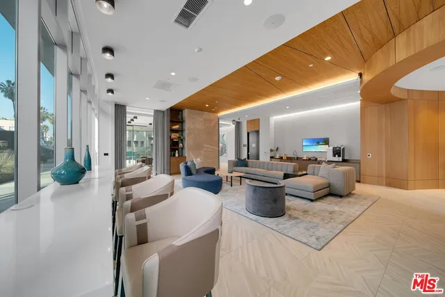 a living room with furniture a window and a table