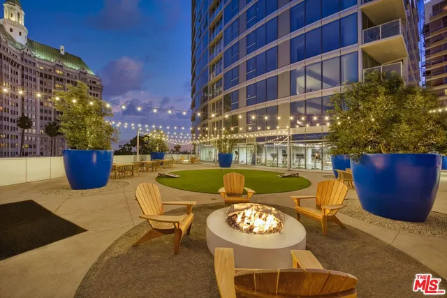 a view of a swimming pool with outdoor seating