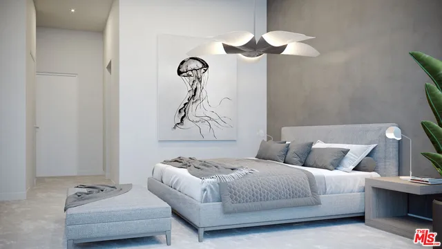 a bedroom with a bed and a couch