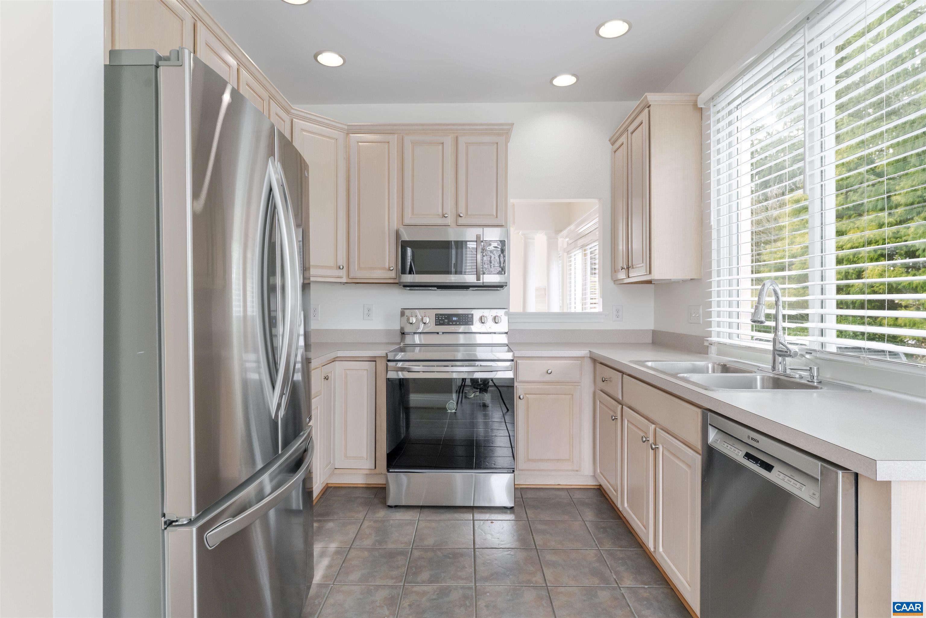 1202 Stonegate Way Crozet, VA 22932 - Photo 13 of 42 a kitchen with stainless steel appliances granite countertop a refrigerator sink and stove