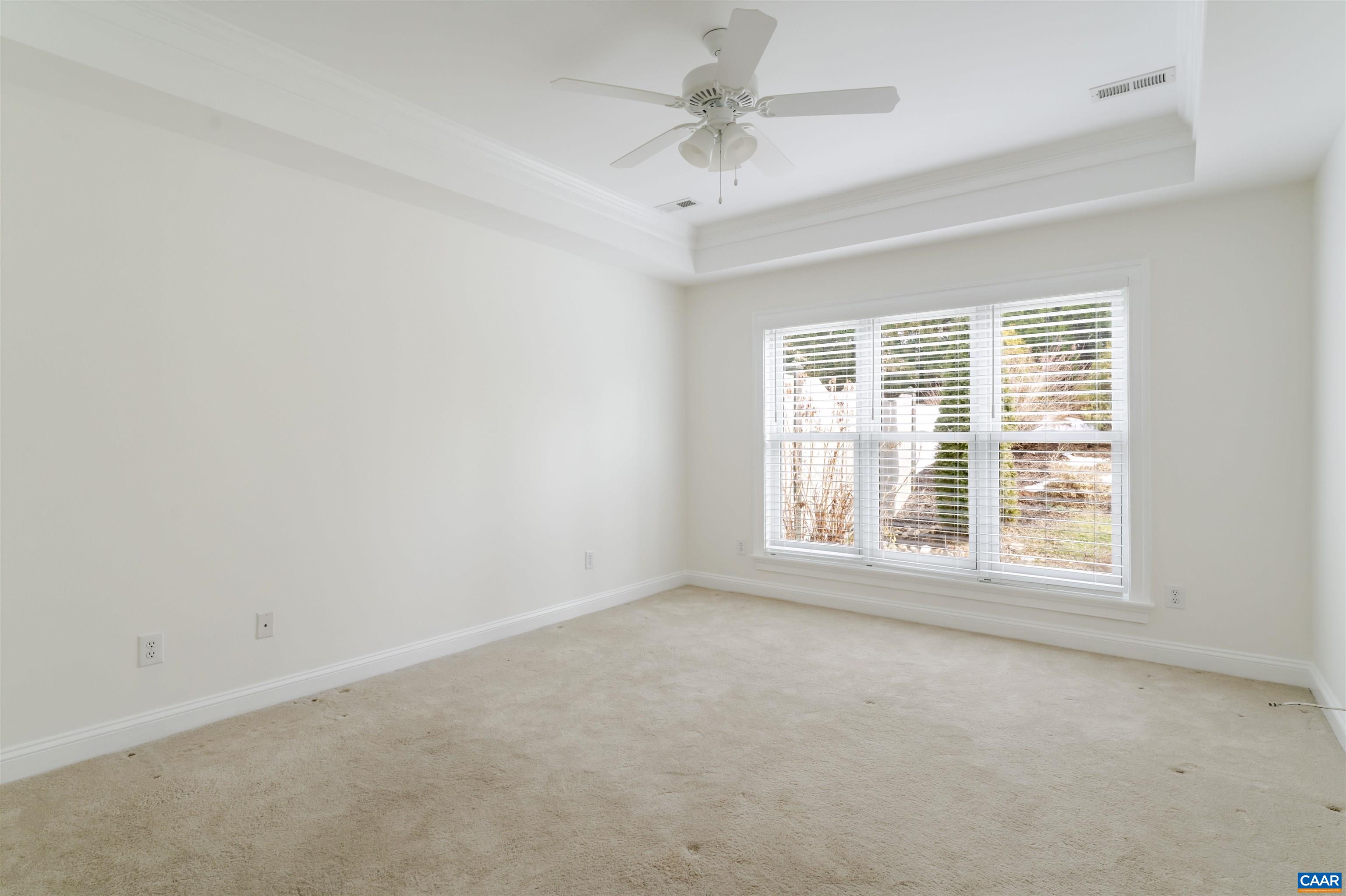 1202 Stonegate Way Crozet, VA 22932 - Photo 18 of 42 an empty room with a window and a ceiling fan