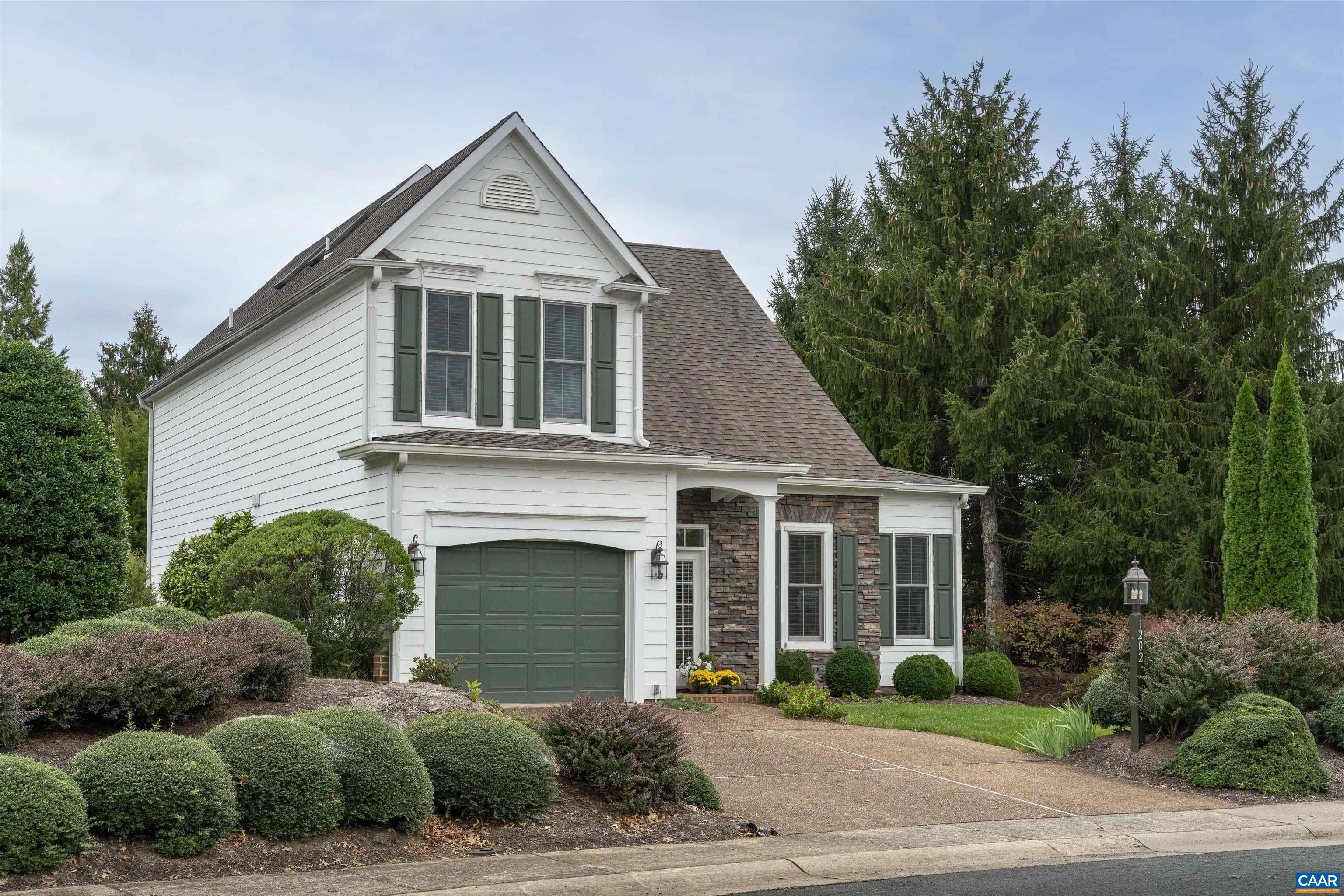 1202 Stonegate Way Crozet, VA 22932 - Photo 2 of 42 a front view of a house with a yard and garage
