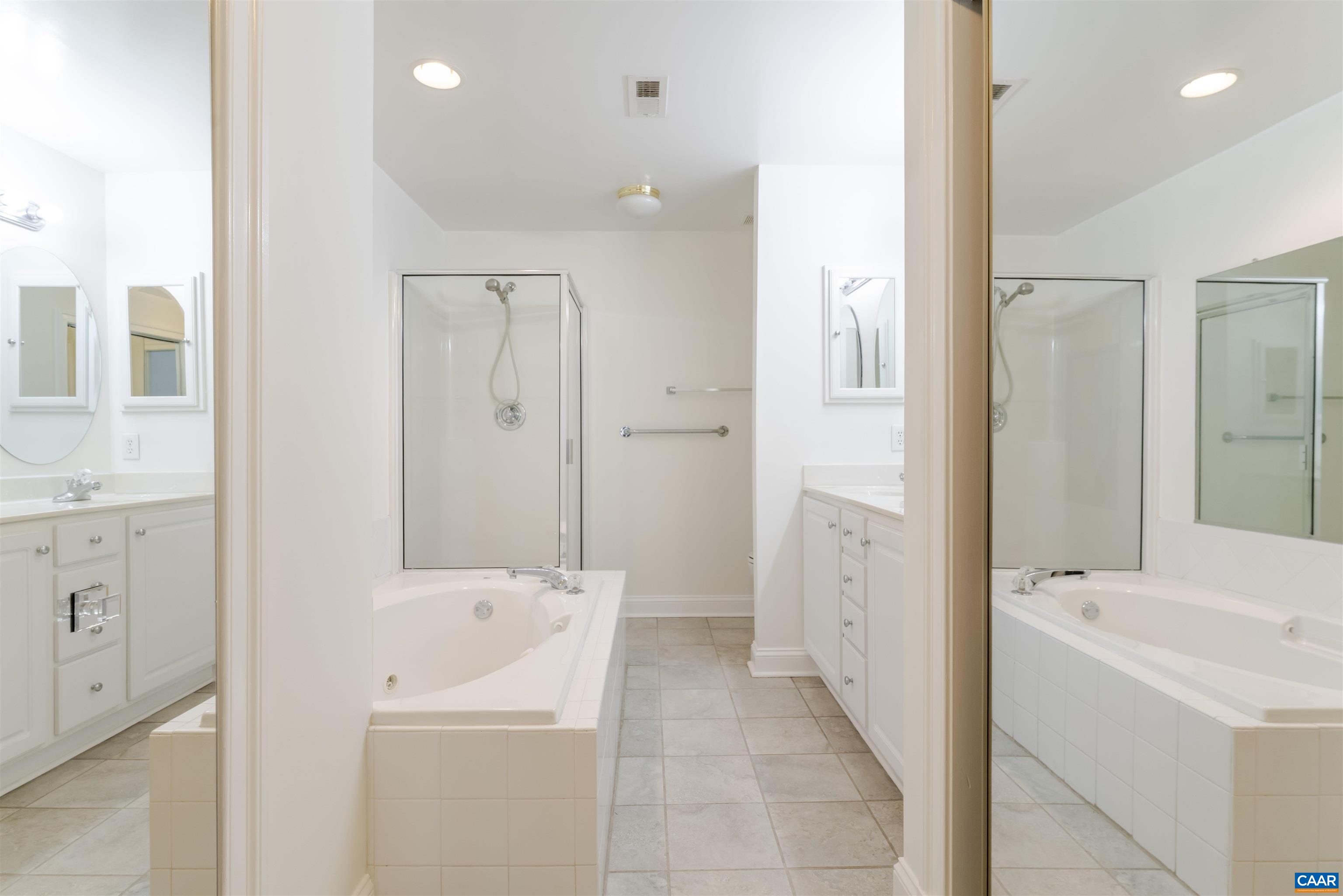 1202 Stonegate Way Crozet, VA 22932 - Photo 21 of 42 a bathroom with a sink a toilet and shower