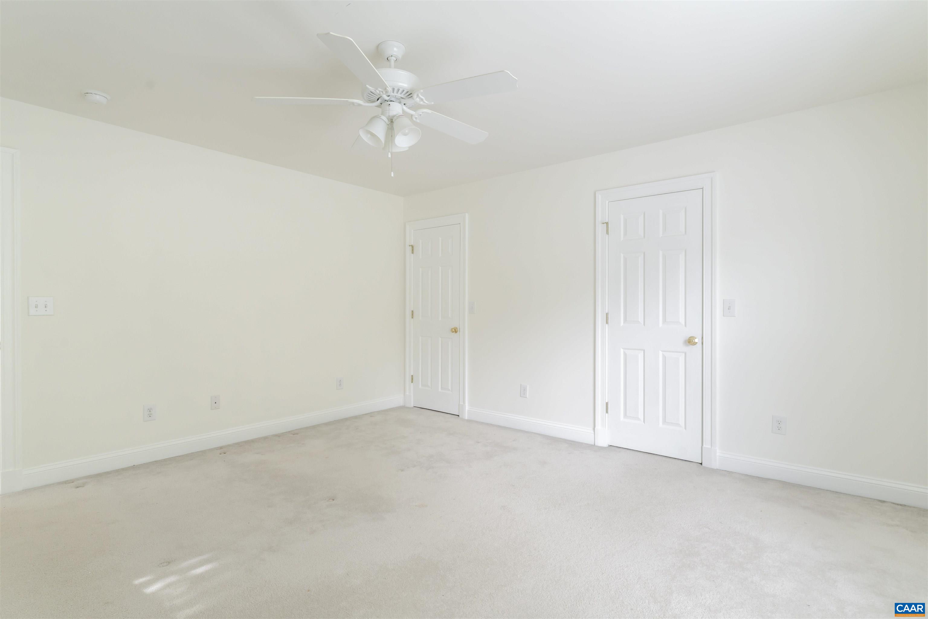 1202 Stonegate Way Crozet, VA 22932 - Photo 24 of 42 an empty room with a ceiling fan