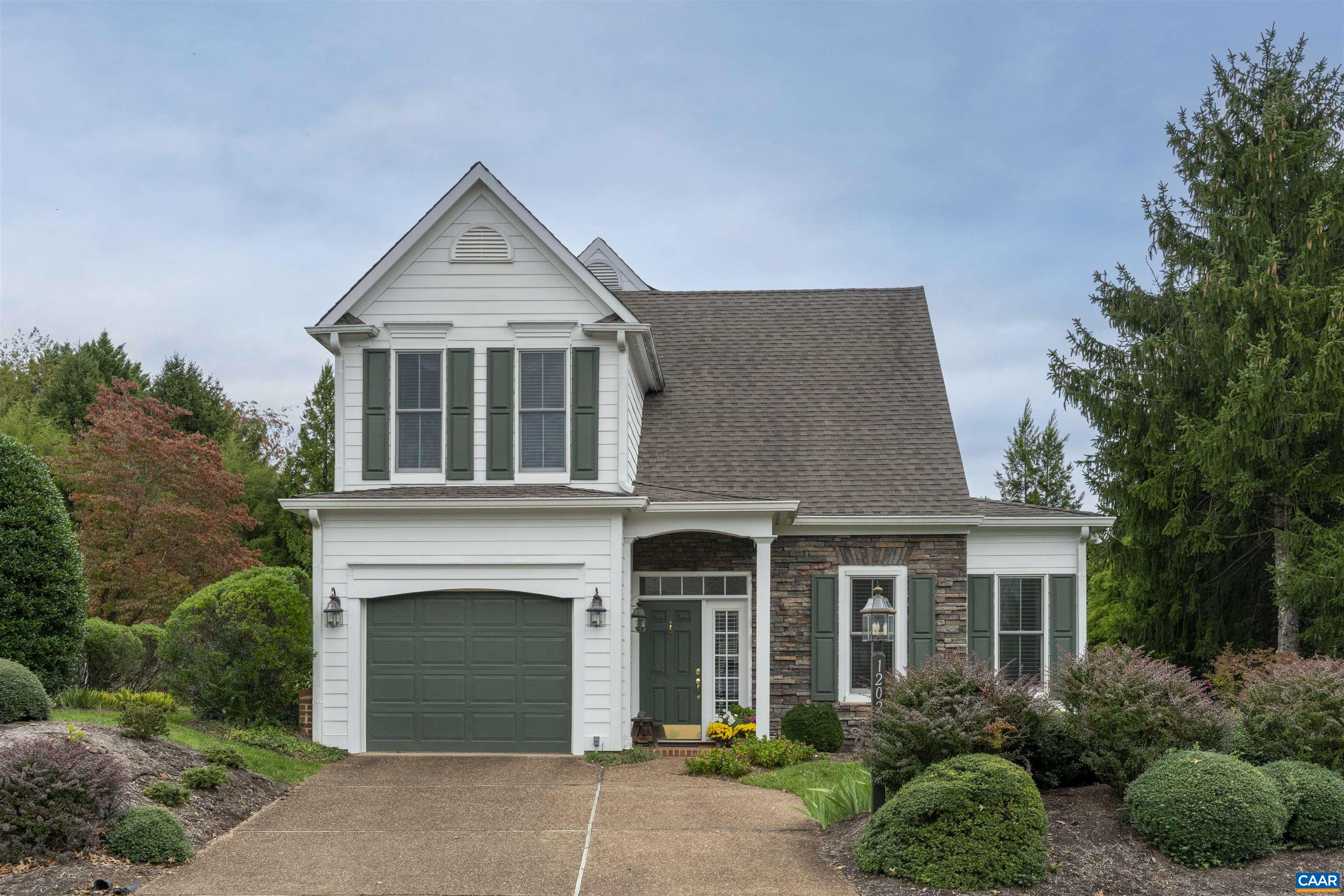 1202 Stonegate Way Crozet, VA 22932 - Photo 3 of 42 a front view of a house with a yard and garage