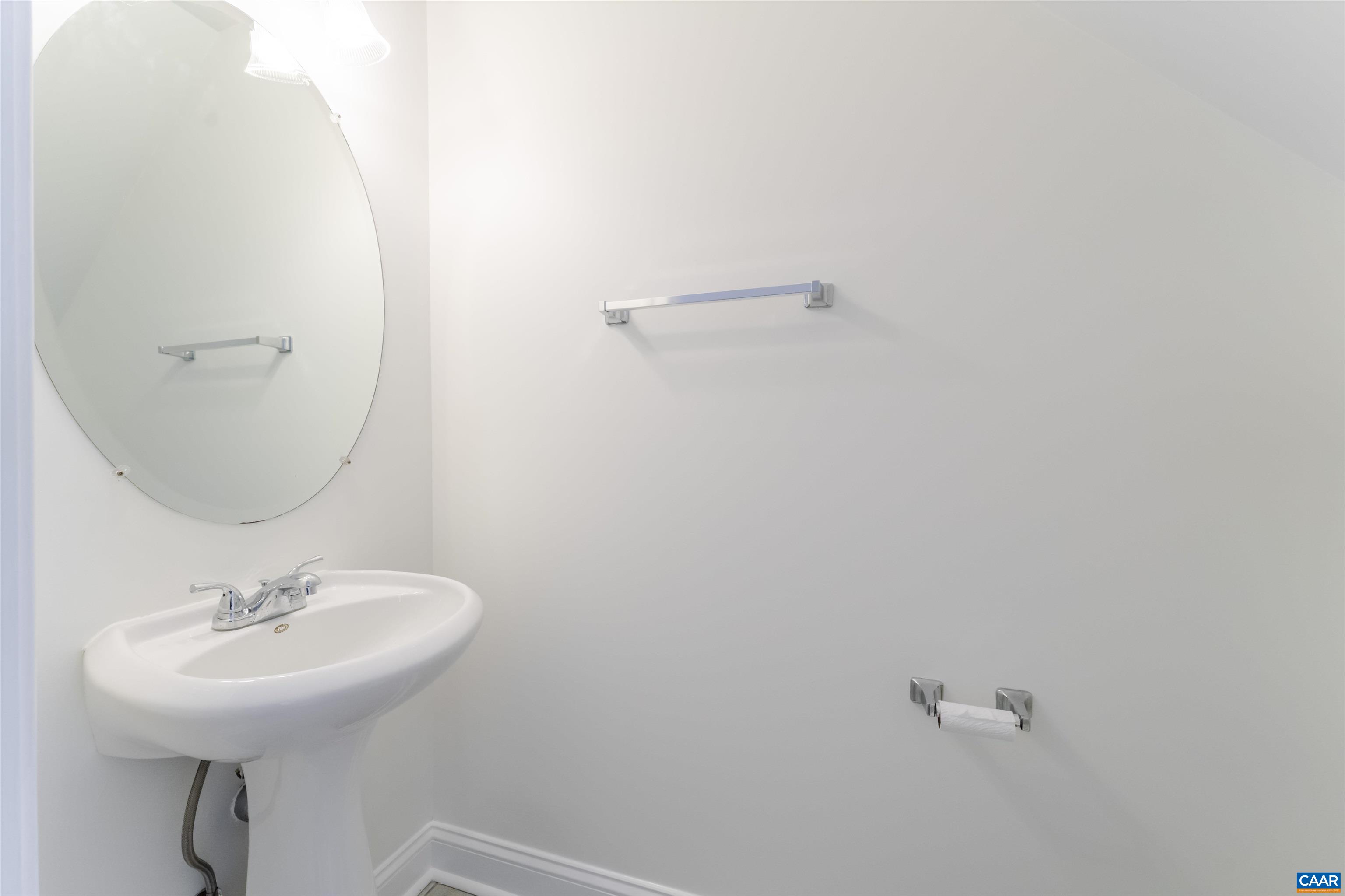 1202 Stonegate Way Crozet, VA 22932 - Photo 31 of 42 a bathroom with a sink a mirror and a toilet