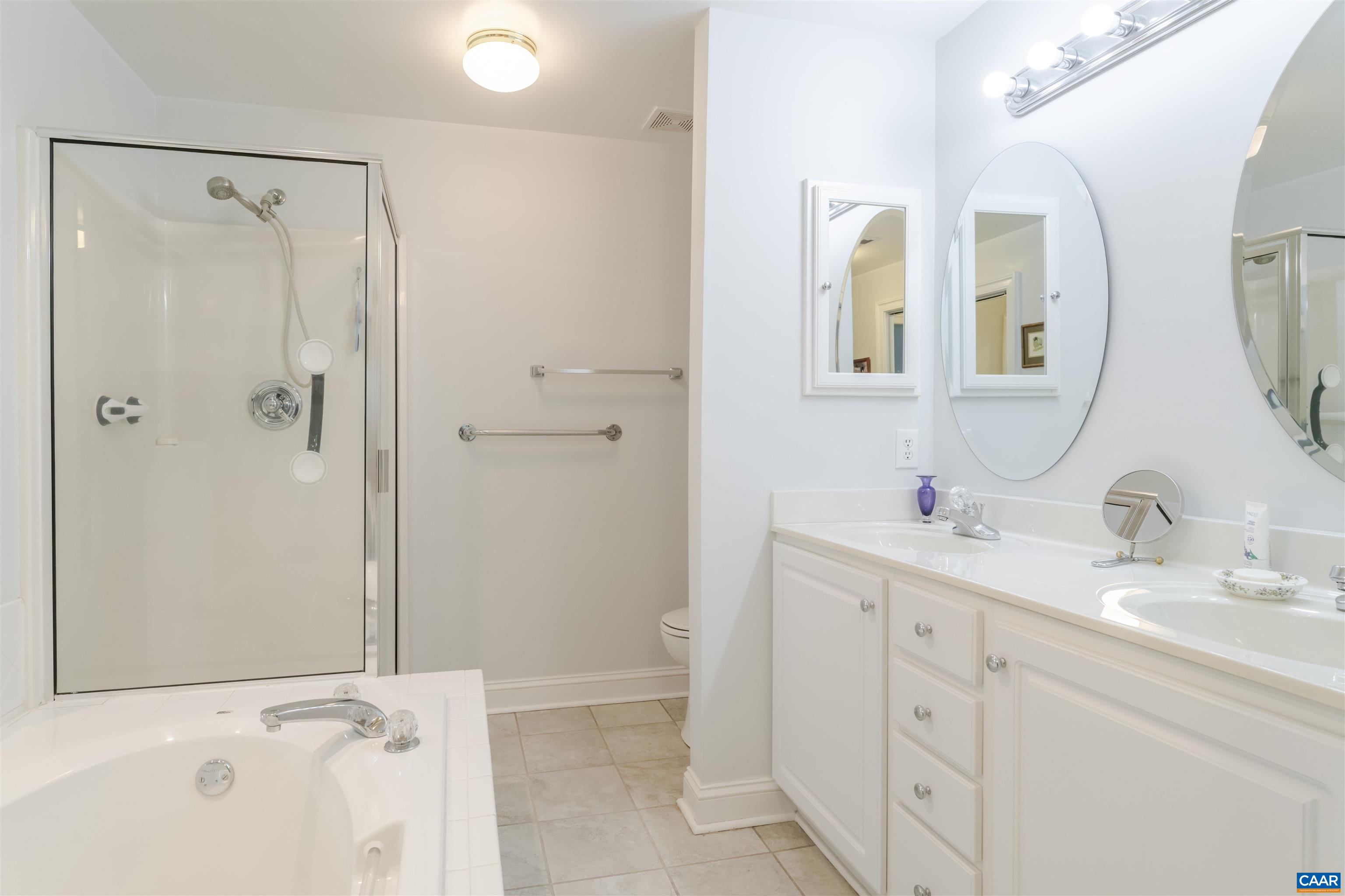1202 Stonegate Way Crozet, VA 22932 - Photo 34 of 42 a bathroom with a double vanity sink mirror and