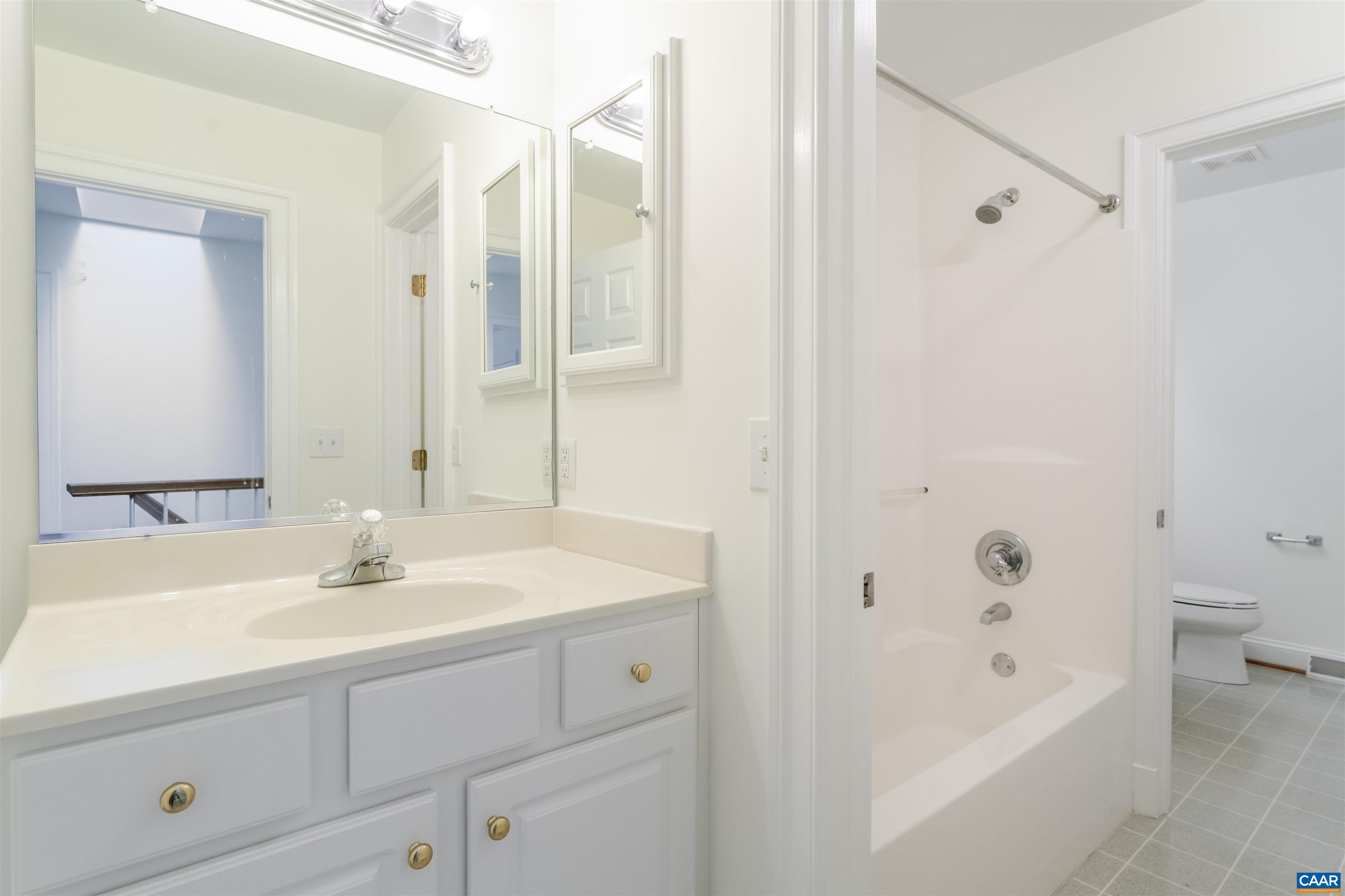 1202 Stonegate Way Crozet, VA 22932 - Photo 36 of 42 a bathroom with a bathtub shower sink and toilet