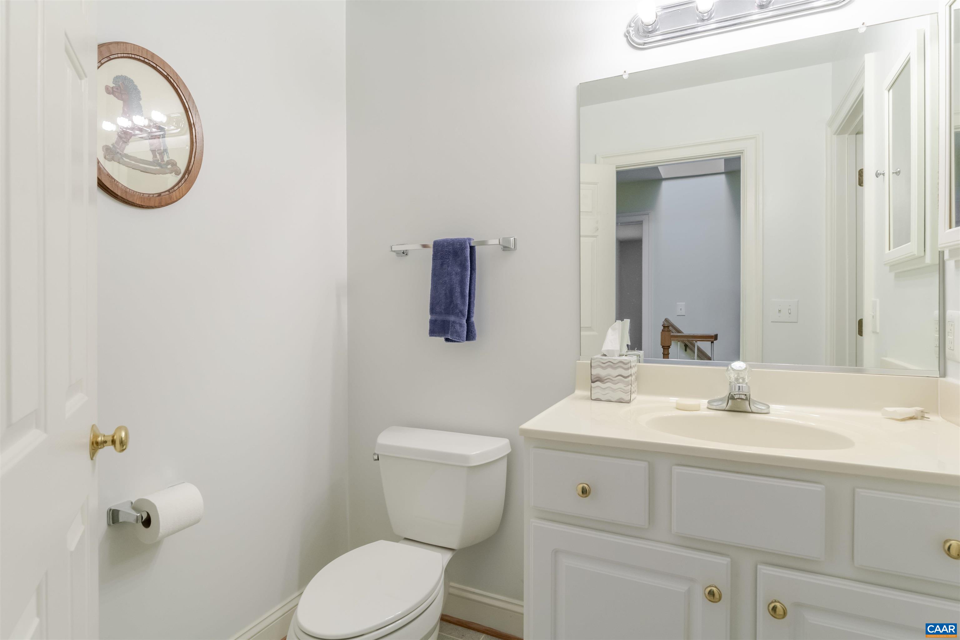 1202 Stonegate Way Crozet, VA 22932 - Photo 37 of 42 a bathroom with a toilet a sink and mirror