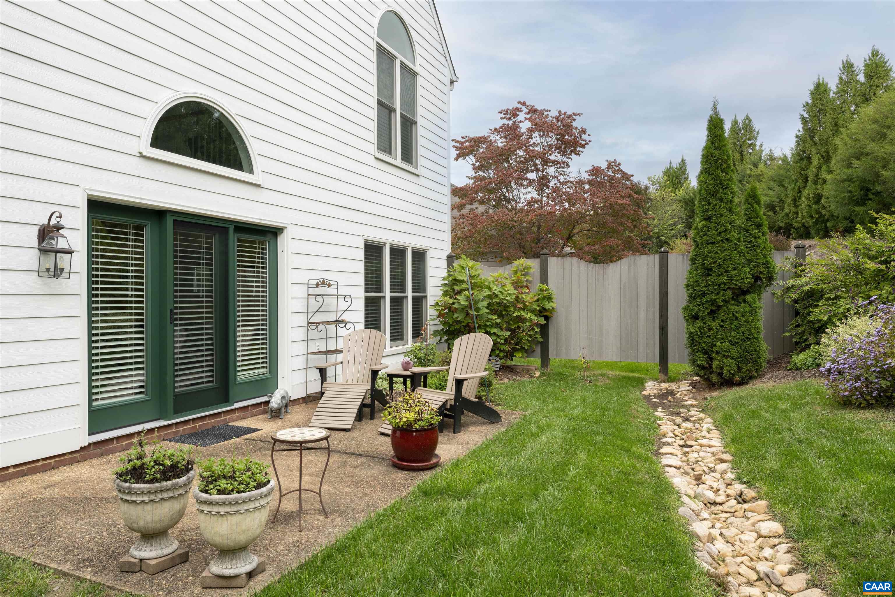 1202 Stonegate Way Crozet, VA 22932 - Photo 40 of 42 a view of a patio with table and chairs and potted plants