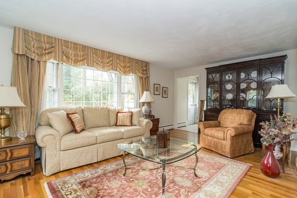 17 Colonial Drive Framingham, MA 01701 - Photo 4 of 27 a living room with furniture and a large window