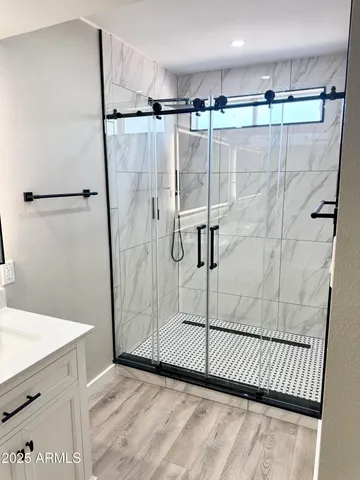 a bathroom with a sink and mirror
