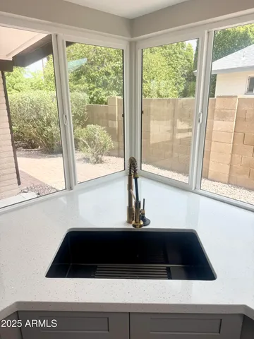 a view of a sink and a window