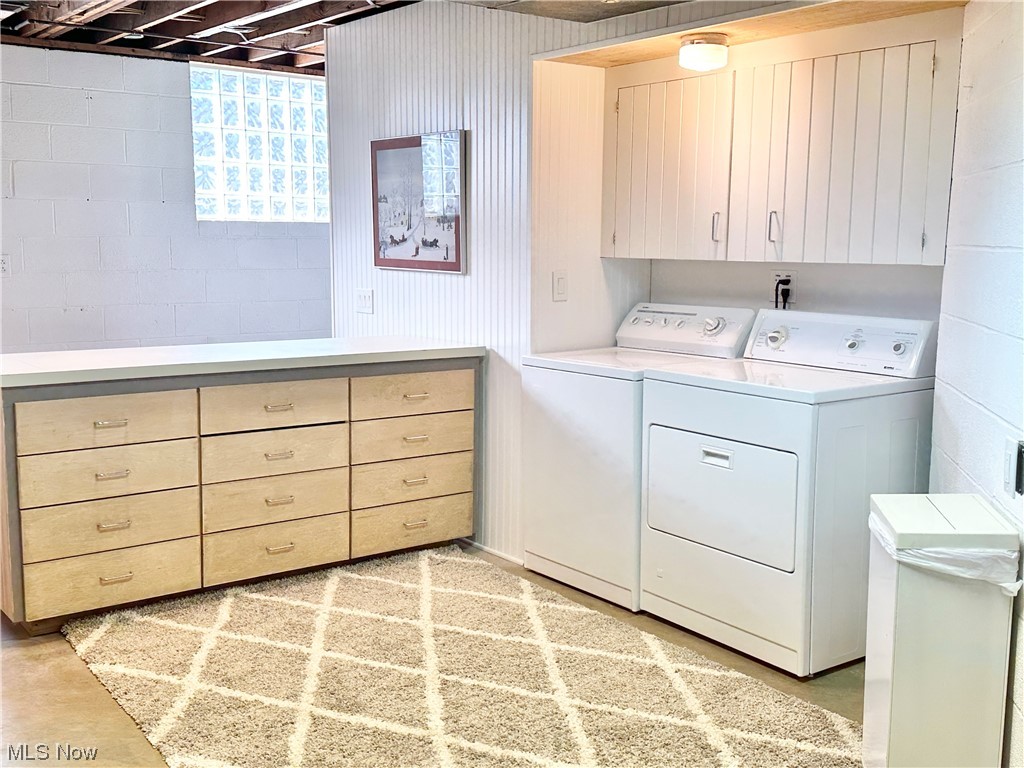 6130 Renninger Road New Franklin, OH 44319 - Photo 17 of 30 with cabinets and washing machine and dryer