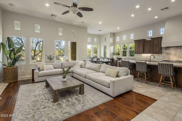 a kitchen with granite countertop a sink and a refrigerator