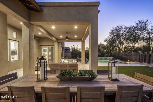 a front view of a house with porch and a yard