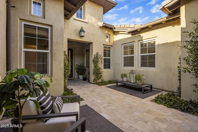 a outdoor living space with furniture and a fireplace