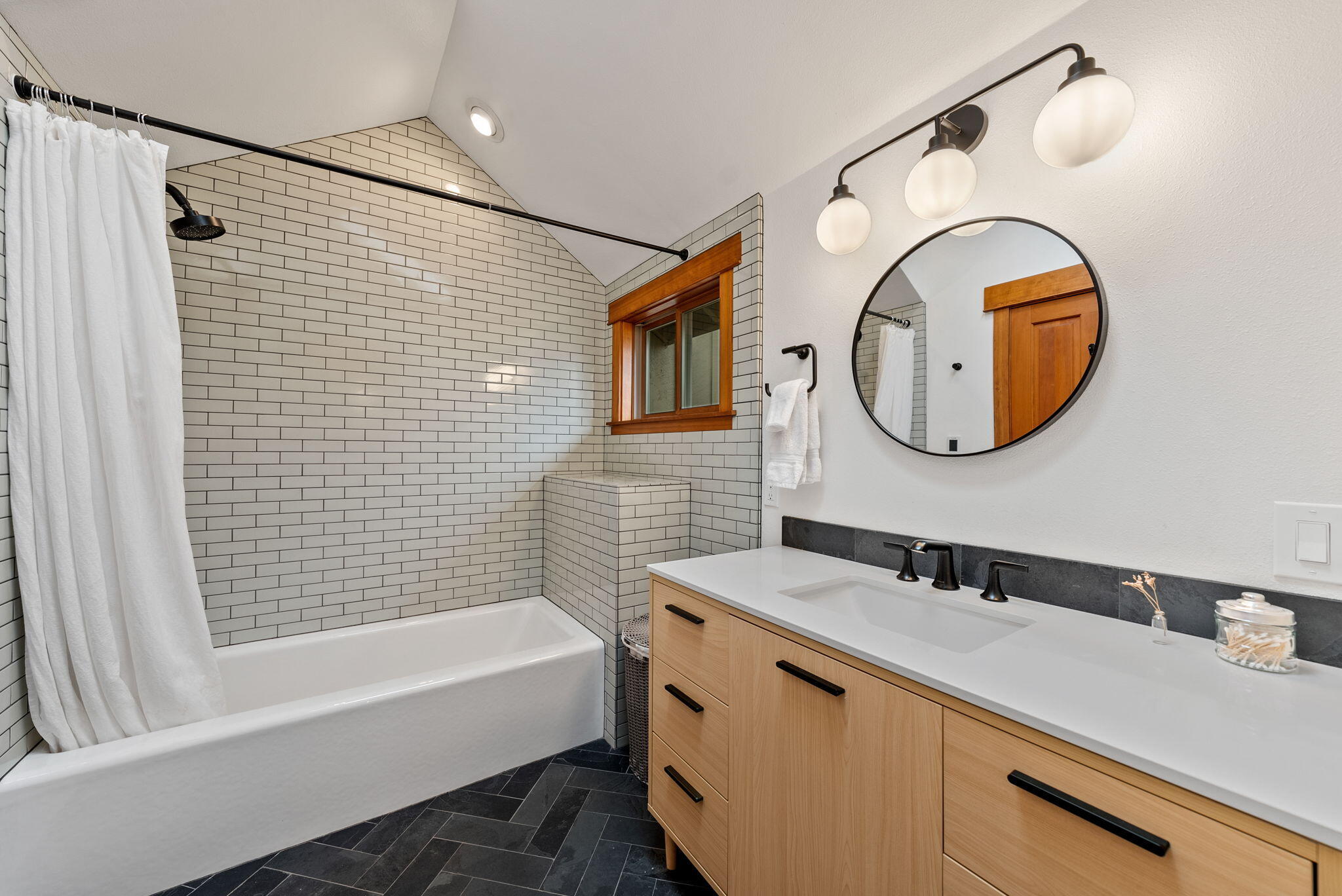 65345 Tweed Road Bend, OR 97703 - Photo 30 of 90 a bathroom with a sink and a mirror