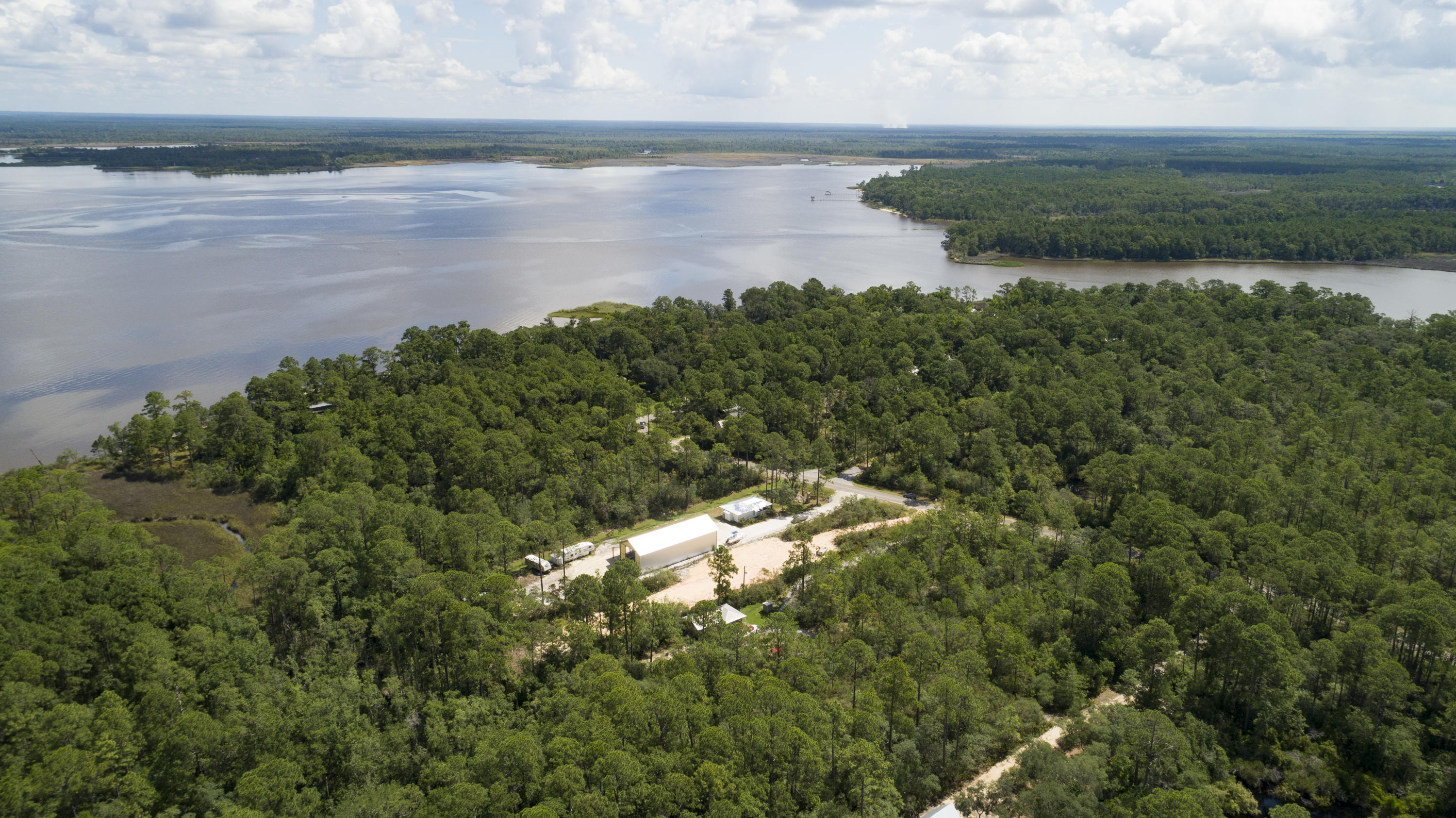 Lot 31 Dick Saltsman Road Santa Rosa Beach, FL 32459 - Photo 2 of 9 a view of a lake with beach and outdoor space