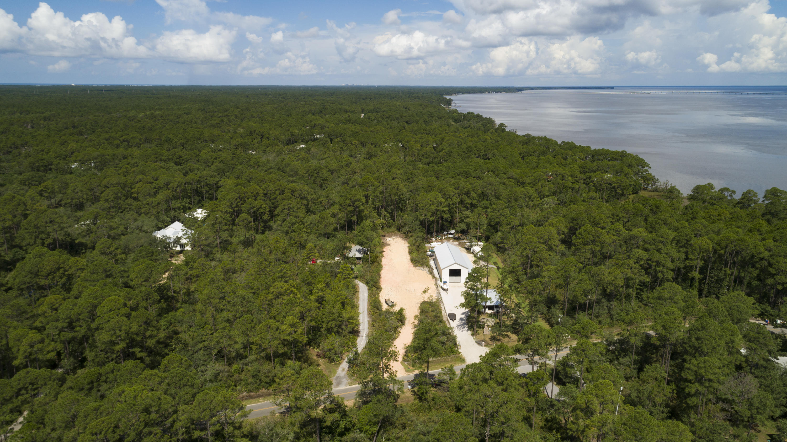 Lot 31 Dick Saltsman Road Santa Rosa Beach, FL 32459 - Photo 3 of 9 a view of a lake from a yard