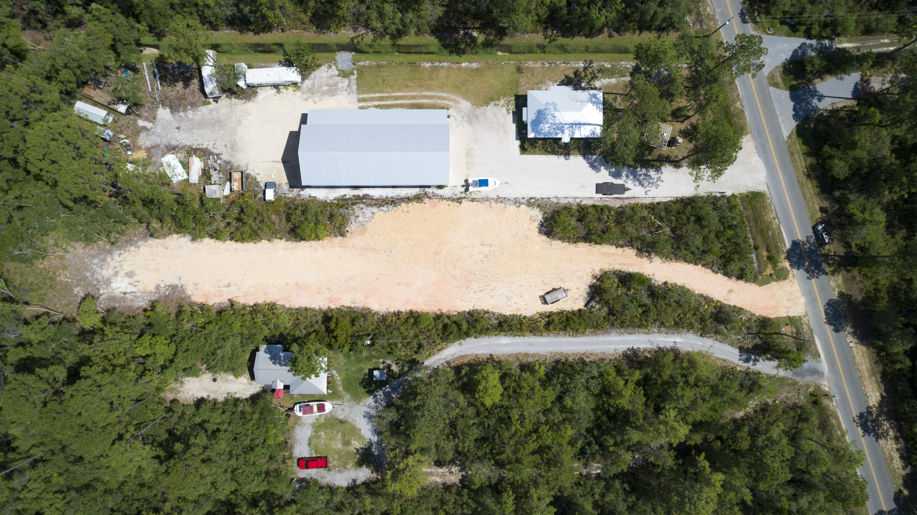 Lot 31 Dick Saltsman Road Santa Rosa Beach, FL 32459 - Photo 4 of 9 an aerial view of residential houses with outdoor space and lake view