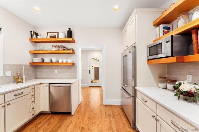 a view of a workspace with furniture and entryway