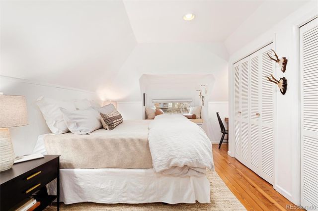 a bedroom with a bed and a couch