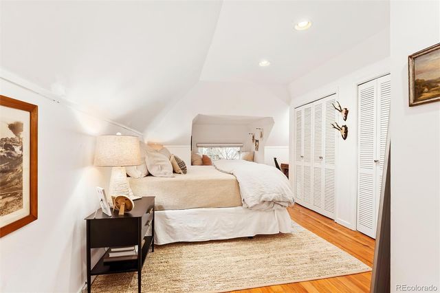 a bedroom with a bed and a table