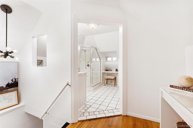a bathroom with a shower sink and mirror