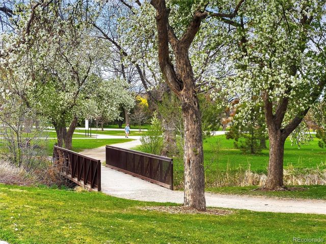 a view of a lake with boats and trees in the background