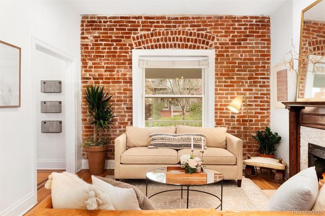 a living room with furniture and a table