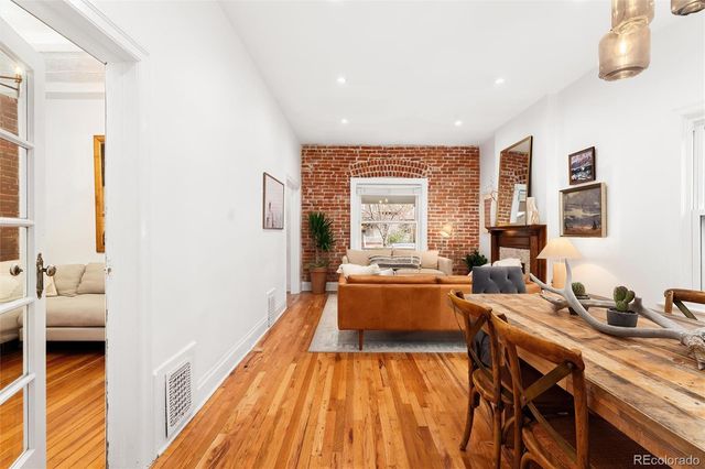 a kitchen with a stove cabinets and a window
