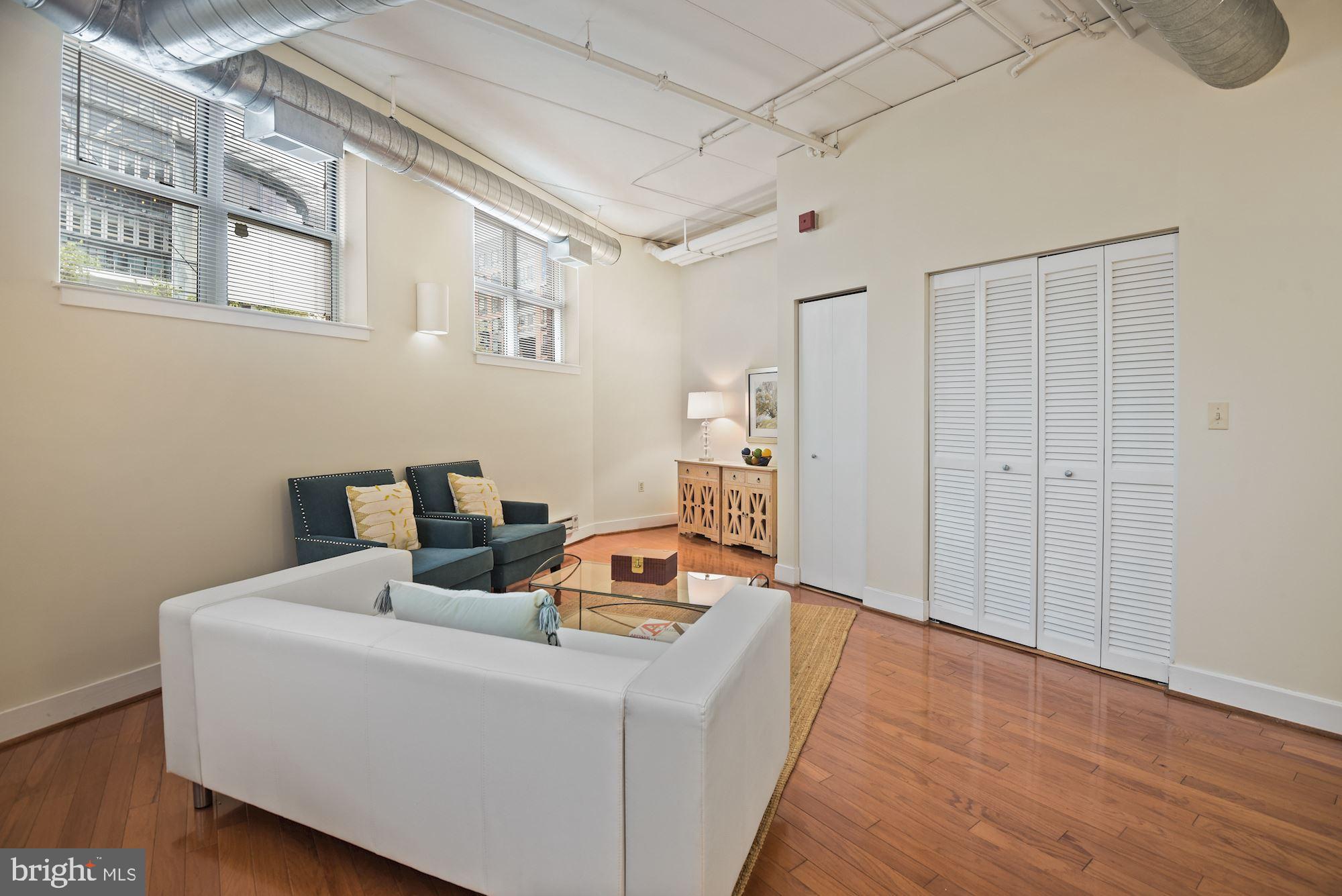 902 Bonifant Street, Unit A Silver Spring, MD 20910 - Photo 12 of 32 Large living room with gleaming hardwood floors