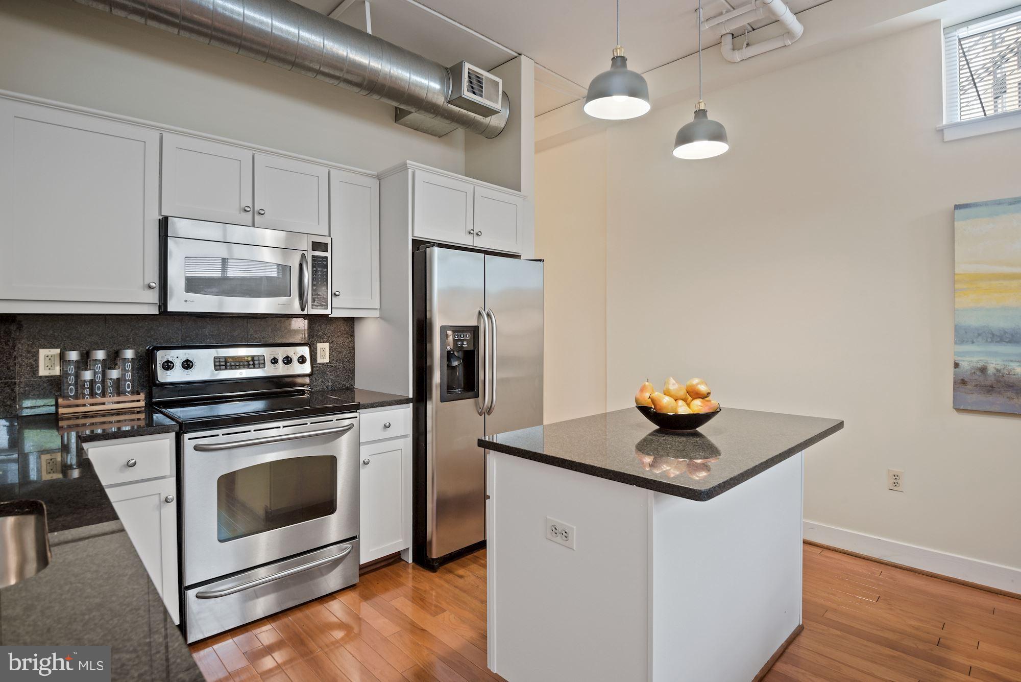 902 Bonifant Street, Unit A Silver Spring, MD 20910 - Photo 6 of 32 Open gourmet kitchen with center island